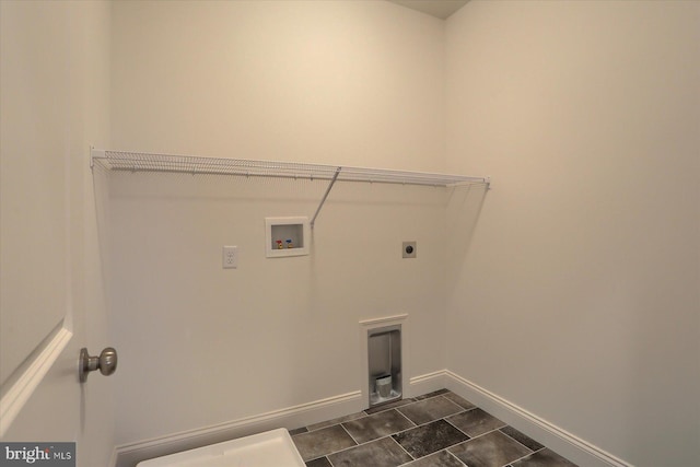 laundry room featuring electric dryer hookup, baseboards, washer hookup, and laundry area