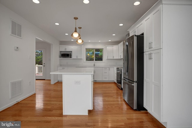 kitchen featuring plenty of natural light, visible vents, and stainless steel appliances