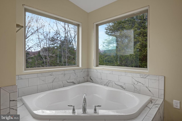 full bath with a garden tub