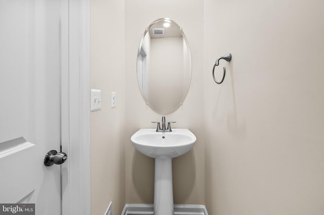 bathroom featuring baseboards