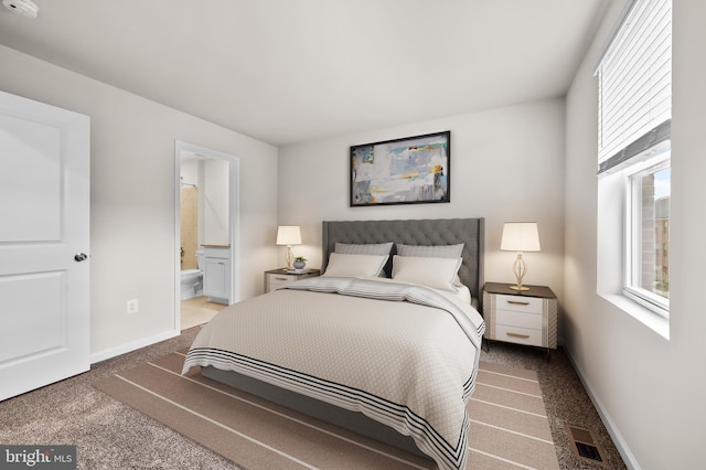 carpeted bedroom featuring visible vents, baseboards, and ensuite bath