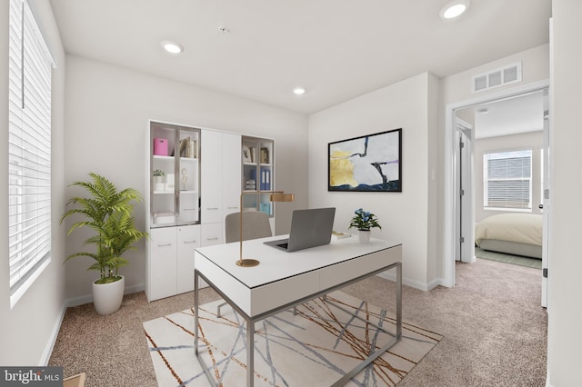 office area with recessed lighting, visible vents, baseboards, and light colored carpet