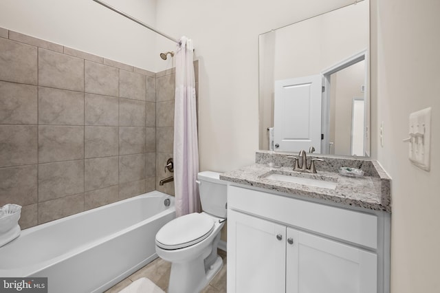 full bathroom featuring toilet, shower / bath combo with shower curtain, and vanity