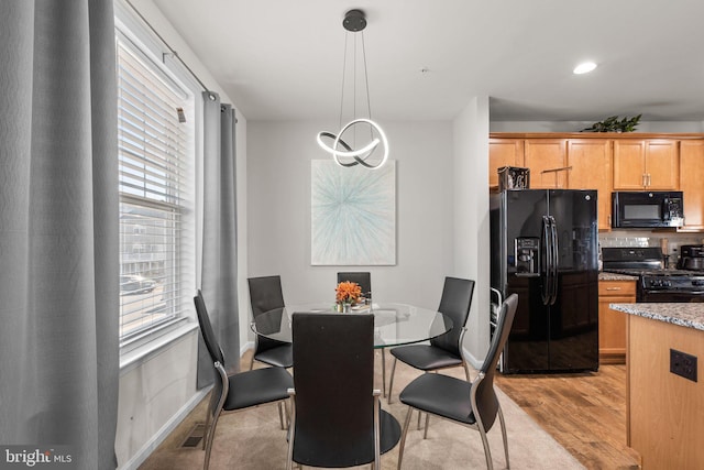 dining area with recessed lighting, light wood-type flooring, baseboards, and visible vents