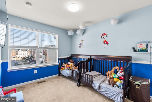 bedroom with carpet, visible vents, and baseboards