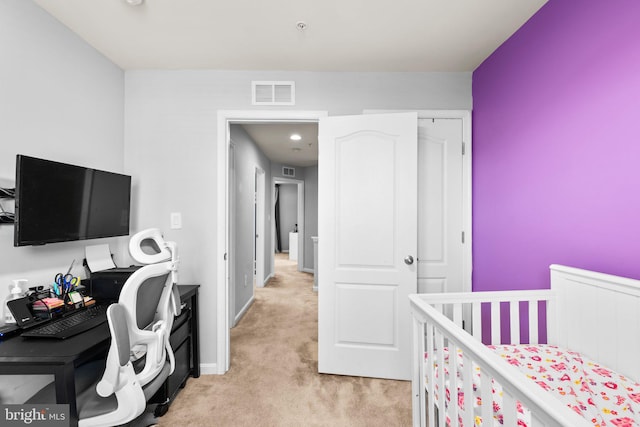 bedroom with light carpet, visible vents, and baseboards