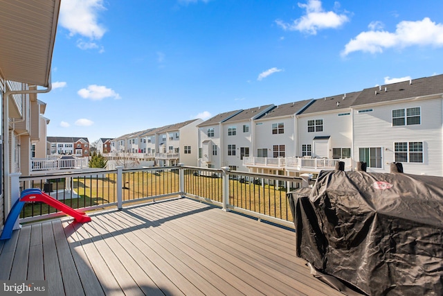 wooden deck with a residential view