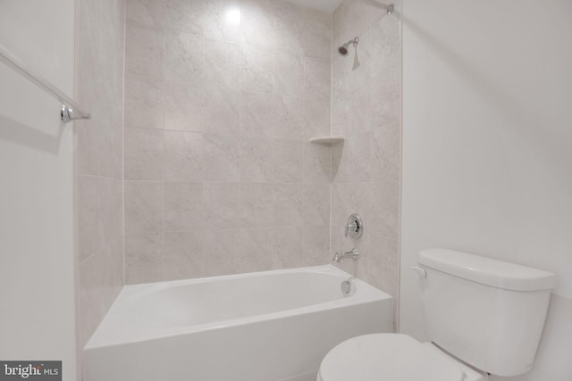 bathroom with toilet and washtub / shower combination