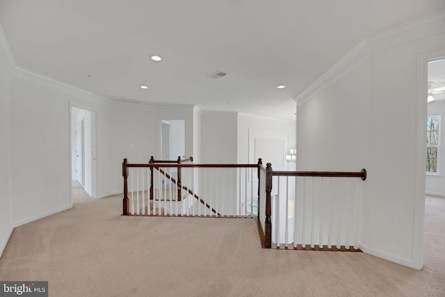 hall featuring carpet flooring, an upstairs landing, baseboards, and visible vents