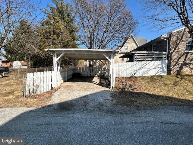 exterior space featuring fence and driveway