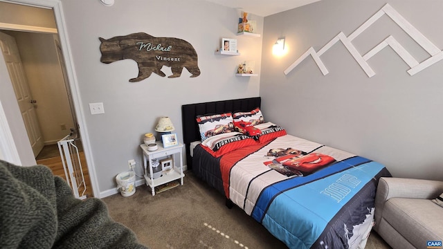 carpeted bedroom featuring baseboards