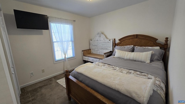 bedroom featuring baseboards and carpet flooring