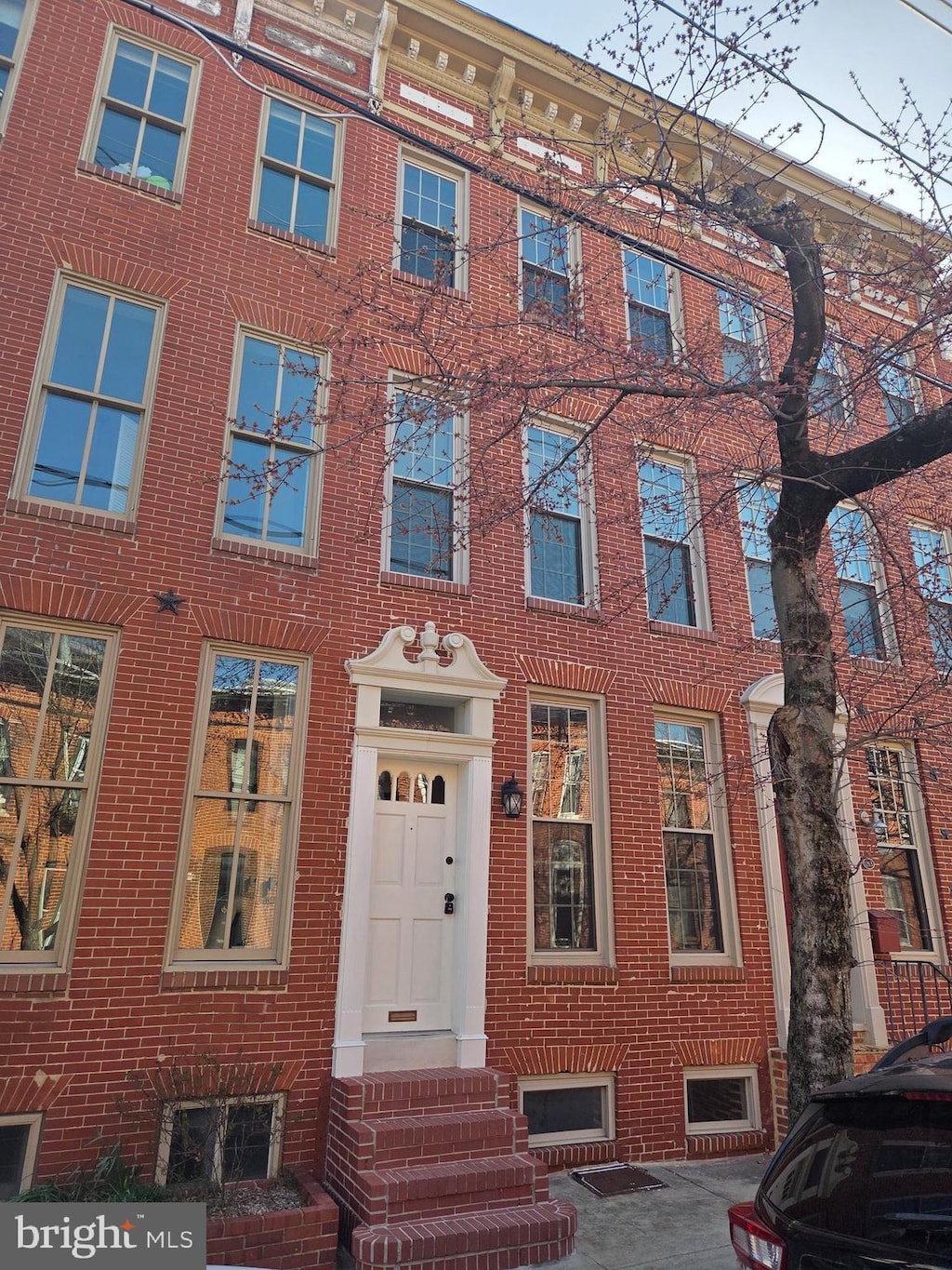 multi unit property featuring brick siding