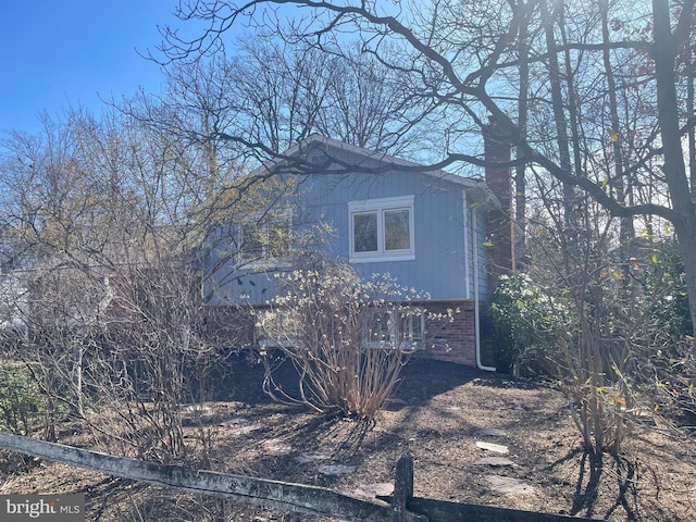 view of home's exterior featuring brick siding