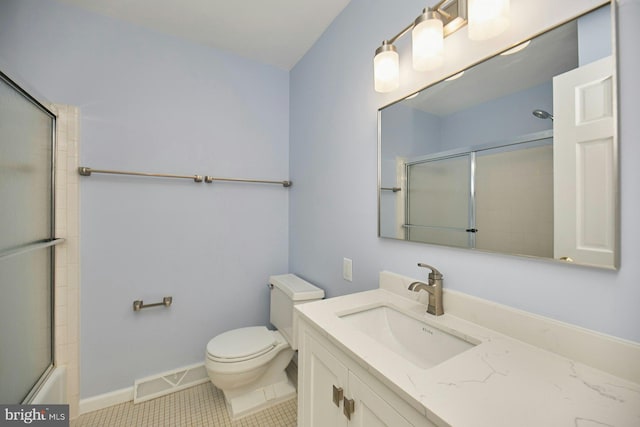 full bath with vanity, baseboards, visible vents, tile patterned floors, and toilet