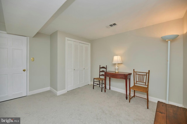 office space featuring visible vents, baseboards, and carpet flooring