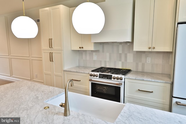 kitchen featuring custom exhaust hood, decorative backsplash, white appliances, and light stone counters