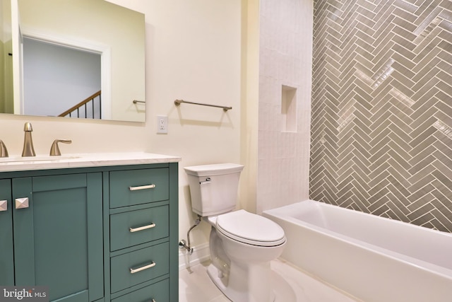 bathroom featuring washtub / shower combination, toilet, and vanity