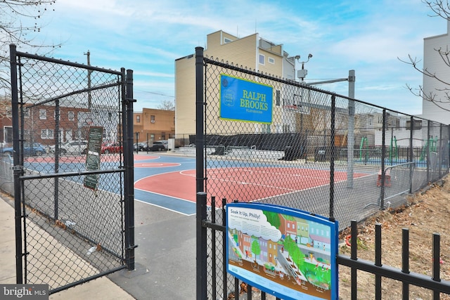 view of sport court featuring community basketball court and fence