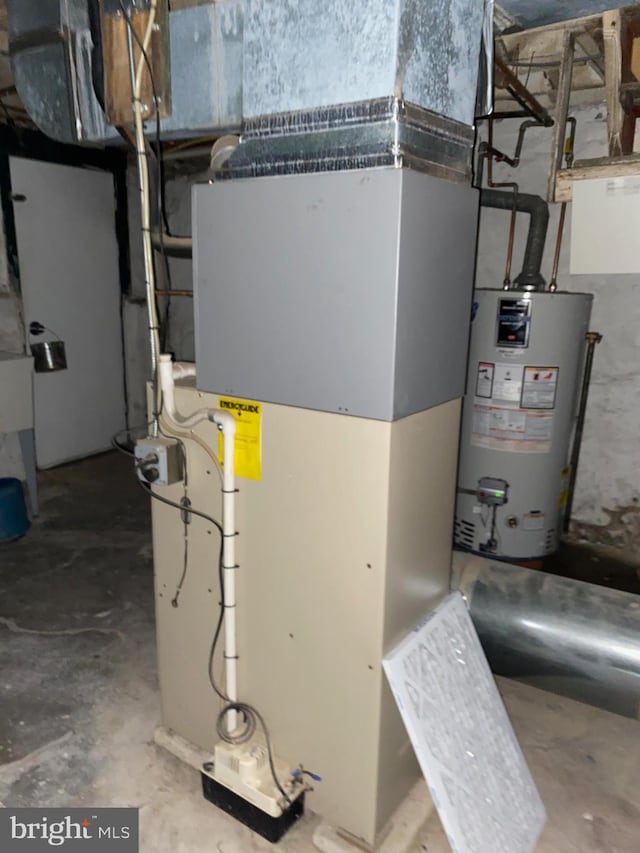 utility room with water heater and heating unit