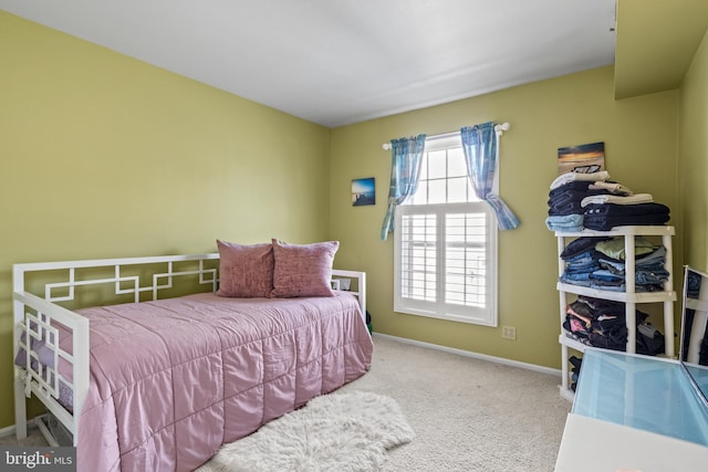 bedroom featuring carpet flooring and baseboards