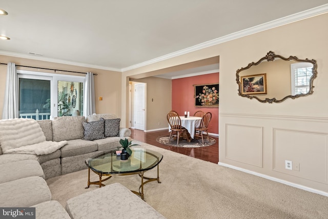 living room featuring crown molding and wood finished floors