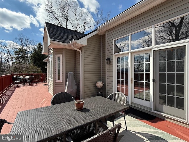 wooden terrace featuring outdoor dining area