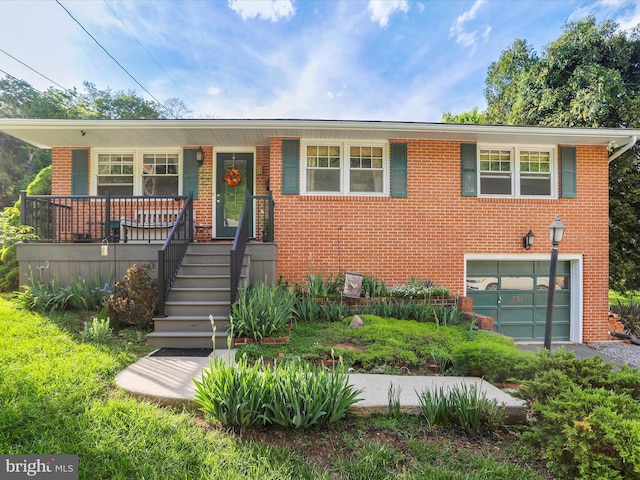 731 Fayette St, Cumberland, MD 21502 - view of front facade with covered porch, brick siding, and an attached garage