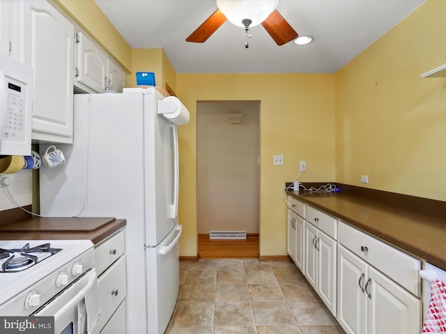 731 Fayette St, Cumberland, MD 21502 - kitchen with dark countertops, white cabinetry, visible vents, ceiling fan, and white appliances