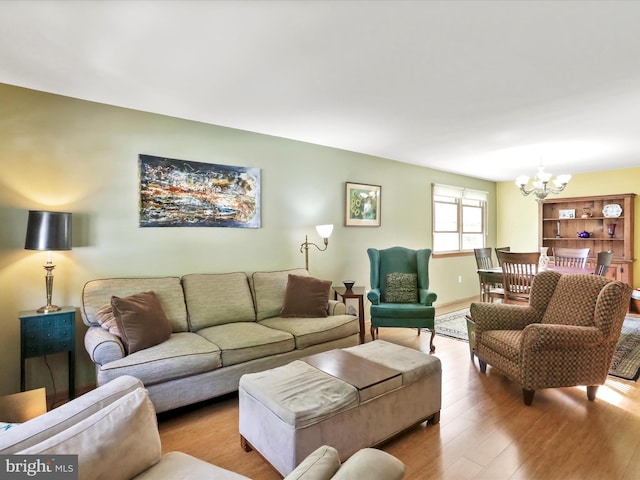 731 Fayette St, Cumberland, MD 21502 - living room with a notable chandelier and wood finished floors