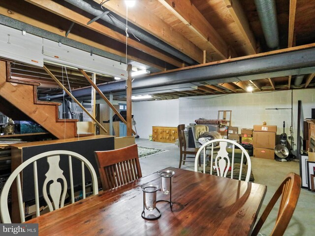 731 Fayette St, Cumberland, MD 21502 - dining area with stairway, concrete flooring, and concrete block wall