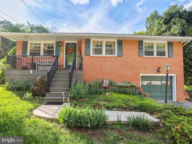 731 Fayette St, Cumberland, MD 21502 - view of front of property featuring a porch, brick siding, and an attached garage
