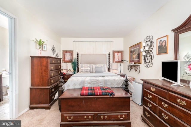 bedroom with light colored carpet