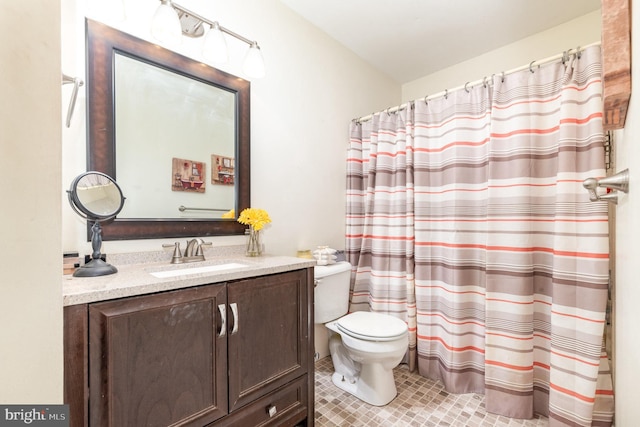 full bath with tile patterned floors, a shower with curtain, toilet, and vanity