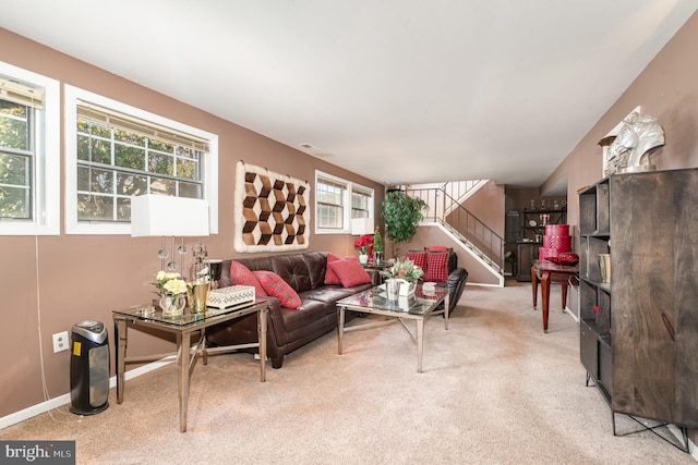 living room featuring stairway and carpet floors