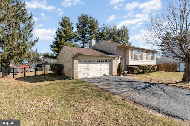 view of front of house with aphalt driveway, fence, a garage, brick siding, and a chimney