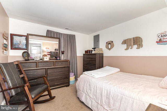 bedroom featuring visible vents and light colored carpet