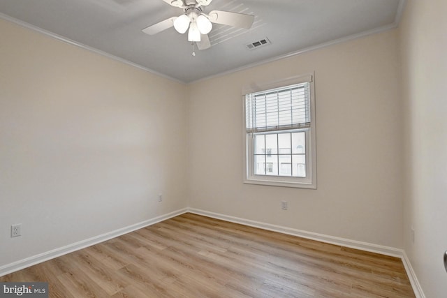 unfurnished room with baseboards, visible vents, light wood-style flooring, ceiling fan, and ornamental molding