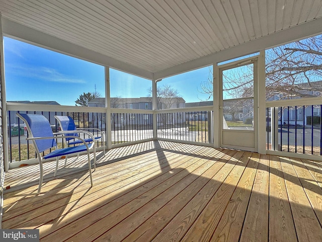 unfurnished sunroom featuring wooden ceiling