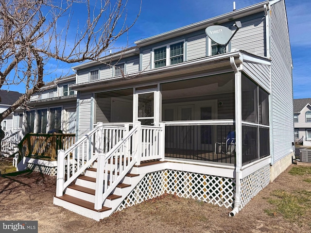 view of front of property featuring a sunroom