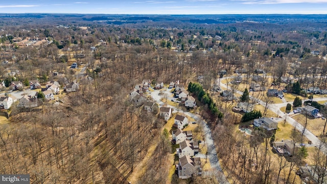 bird's eye view featuring a residential view and a view of trees