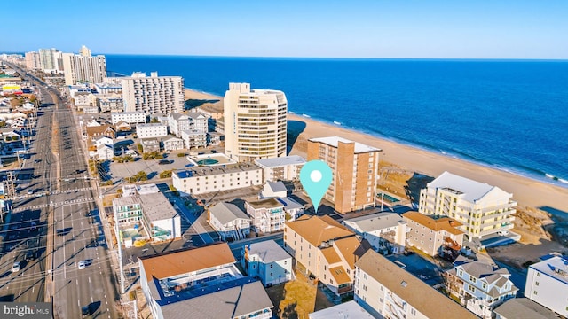 bird's eye view with a water view and a view of the beach