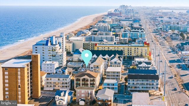 birds eye view of property with a view of city, a view of the beach, and a water view