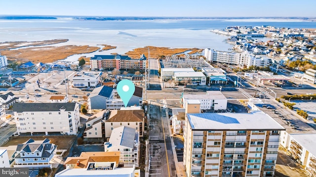 birds eye view of property featuring a view of city and a water view