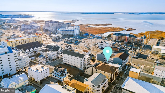 birds eye view of property featuring a view of city and a water view