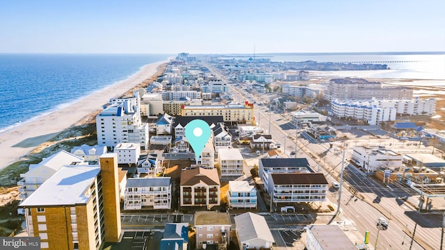 bird's eye view featuring a view of the beach and a water view