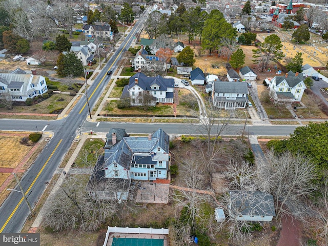 birds eye view of property with a residential view