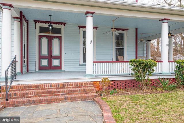 doorway to property with a porch and a ceiling fan