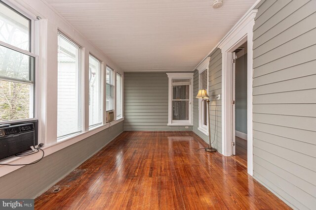 unfurnished sunroom featuring cooling unit