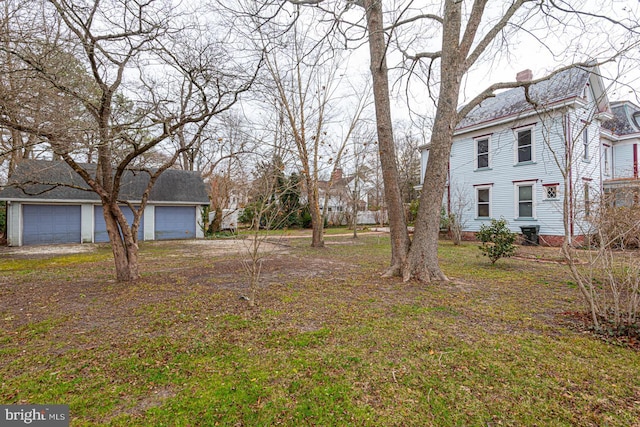 view of yard featuring a garage